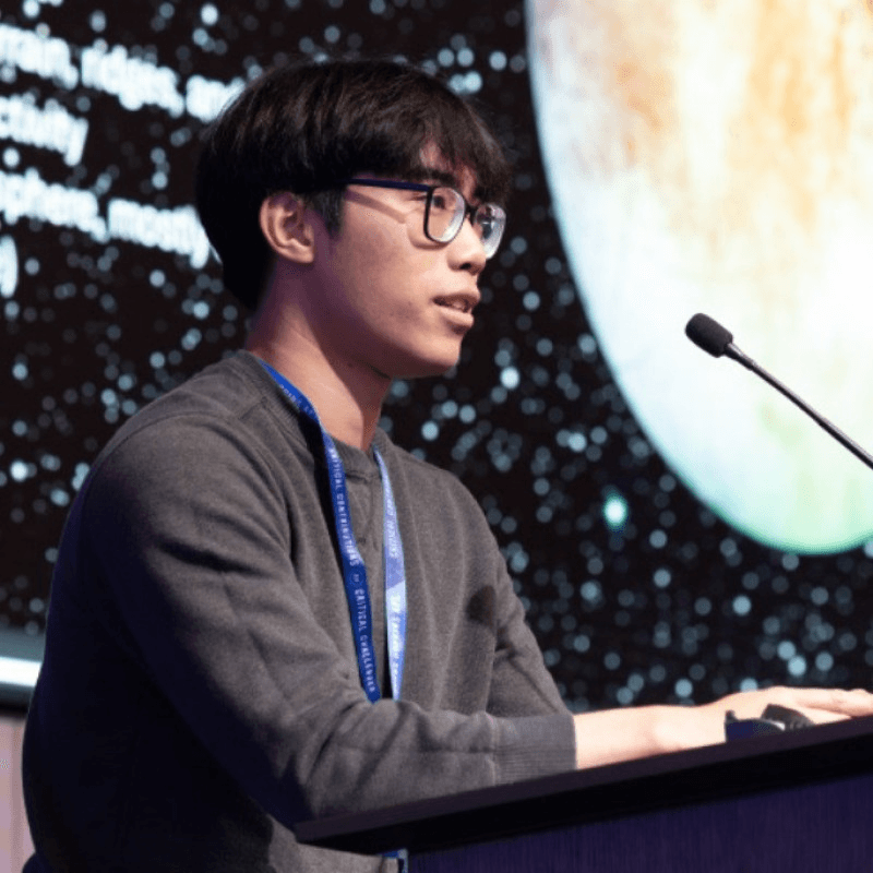 Hung Le speaking at a lectern